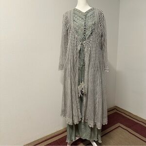Elegant three-piece Pakistani formal outfit in a soft sage green tone